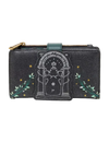A black glittery zip-around wallet featuring a central tombstone graphic with a star and moon design, flanked by green leafy vines and small gold stars, with a gold zipper pull.