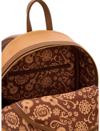 Brown backpack with intricate patterns on a white background