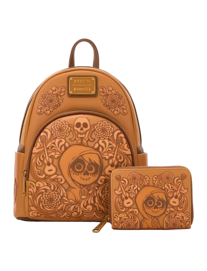 A tan faux-leather backpack and matching zip pouch set, both embossed with a Day of the Dead sugar skull and floral design, shown on a light gray background.