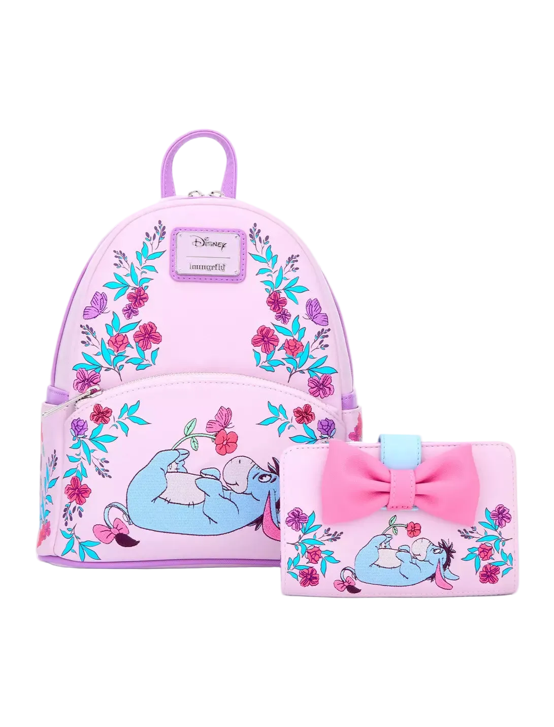 A pink Disney-themed mini backpack and matching wallet set featuring a blue sleeping character, floral patterns, and a large pink bow on the wallet, shown on a light gray background.