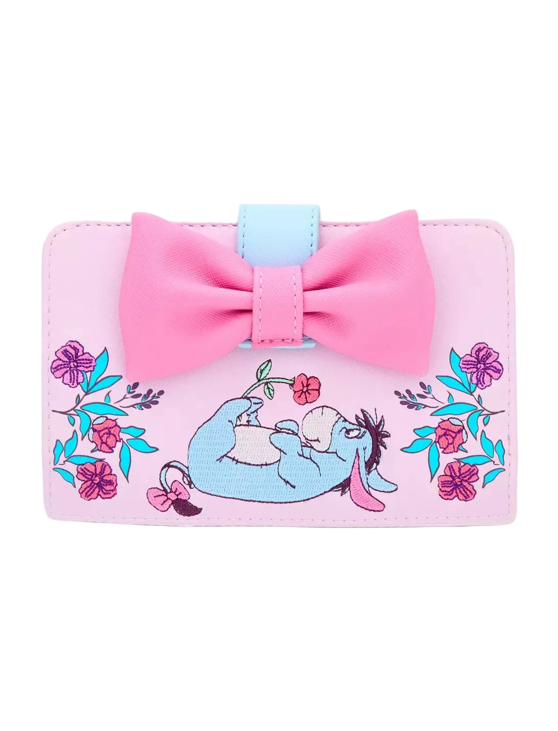 A pink wallet featuring a large pink bow on top, a light blue accent tab, and an embroidered illustration of Eeyore lying down surrounded by pink flowers and blue leaves, set against a plain white background.