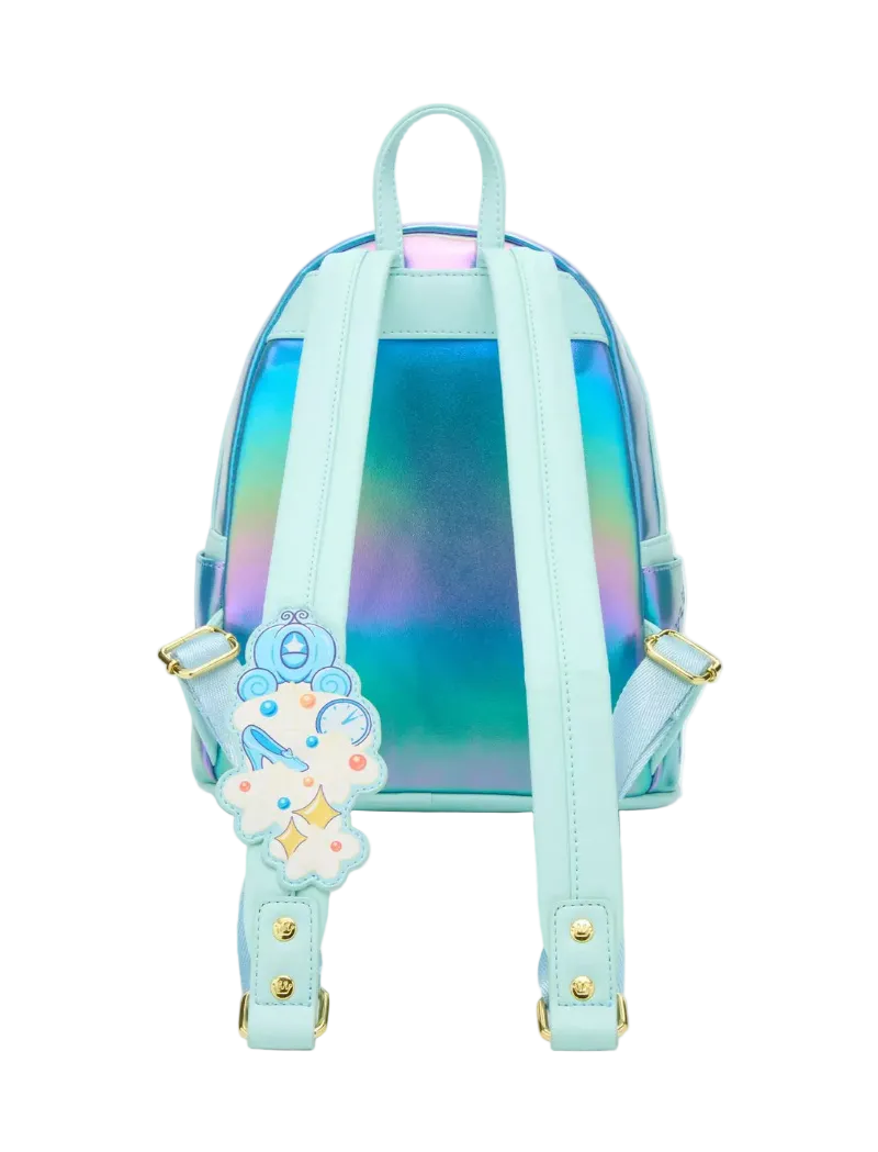 A light blue and iridescent holographic mini backpack with a decorative cloud-shaped charm featuring a blue anchor and gold stars, shown against a plain white background.