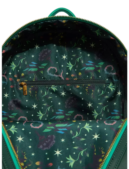 An open backpack showing a dark green interior lined with a colorful fantasy print of stars, planets, and creatures, with a top zipper and a gold-tone pull.