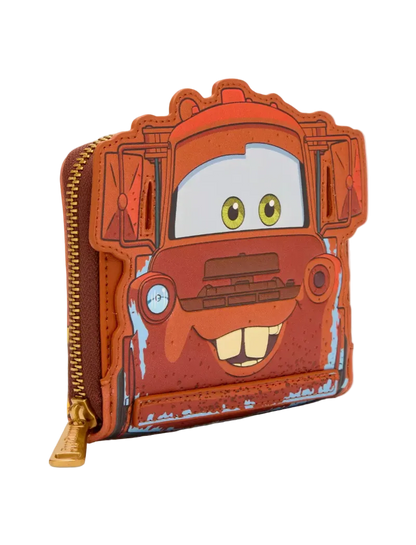 A zip-around wallet shaped like the character Mater from Disney's Cars, featuring a distressed orange-red finish with blue paint details, yellow eyes, and a gold zipper pull, shown on a light gray background.
