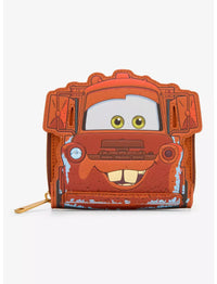 A small zip-around wallet featuring a cartoon-style rusty red car face with green eyes and a distressed paint finish, shown on a plain light background.