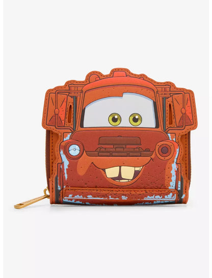 A small zip-around wallet featuring a cartoon-style rusty red car face with green eyes and a distressed paint finish, shown on a plain light background.