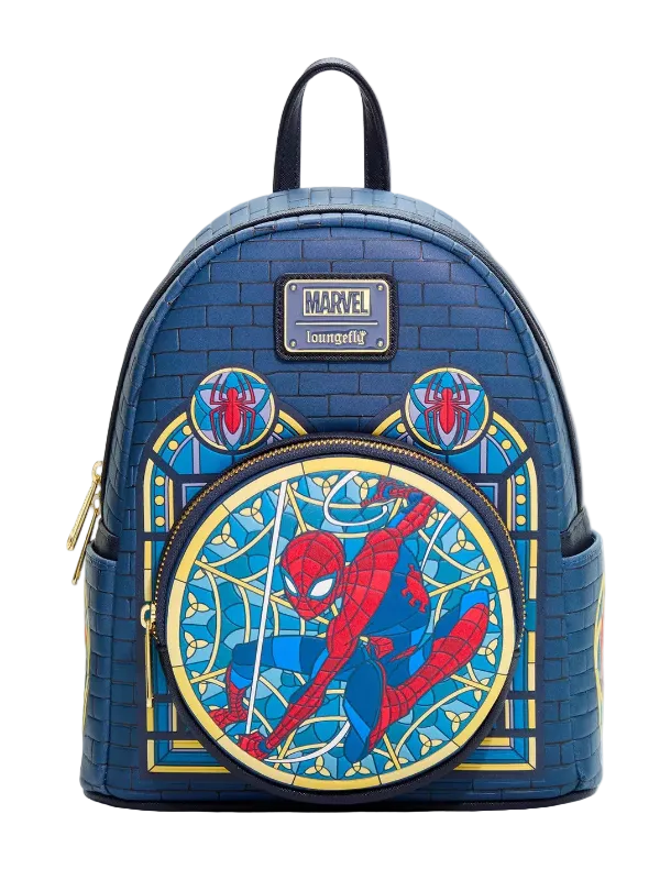 A blue faux-brick textured mini backpack featuring Spider-Man artwork, including a large circular Spider-Man graphic on the front, gold zipper details, and a Marvel logo patch on the upper front.