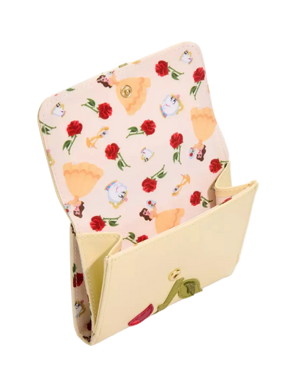 A cream-colored leather wallet shown open, featuring a light pink patterned interior printed with red roses and Disney's Beauty of the Beast characters, with a small gold clasp on the front flap.