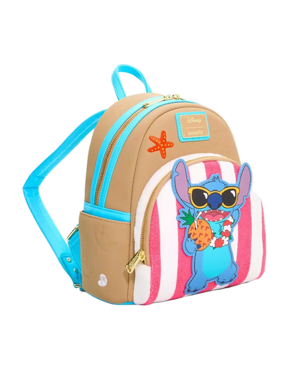 A small tan and pink striped backpack with bright blue straps and trim, gold zippers, a starfish patch, and a cartoon character applique on the front pocket.
