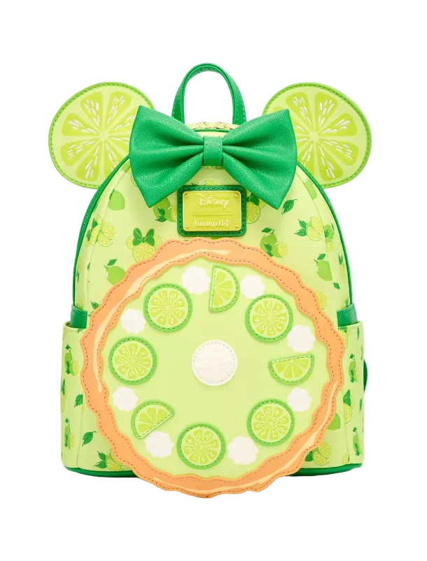 A lime green backpack styled like a Minnie Mouse head, featuring a green bow, round mouse ears with lime slice patterns, and a large circular lime wheel applique on the front pocket.