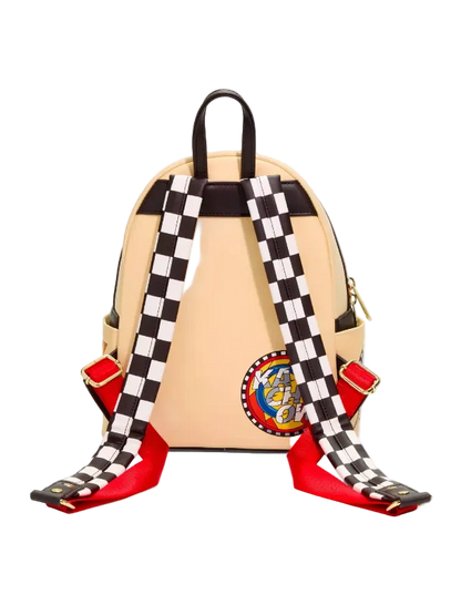 A beige backpack with black and white checkered straps, red footrests, and a circular patch on the lower right, shown against a light gray background.