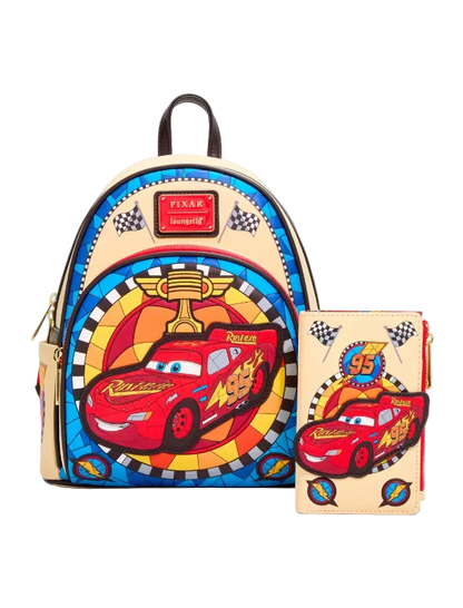 A Disney Pixar Lightning McQueen themed backpack set shown with a matching zip-around wallet. The backpack features a colorful stained-glass style design with a large red Lightning McQueen graphic, a trophy, and checkered accents on a beige base.