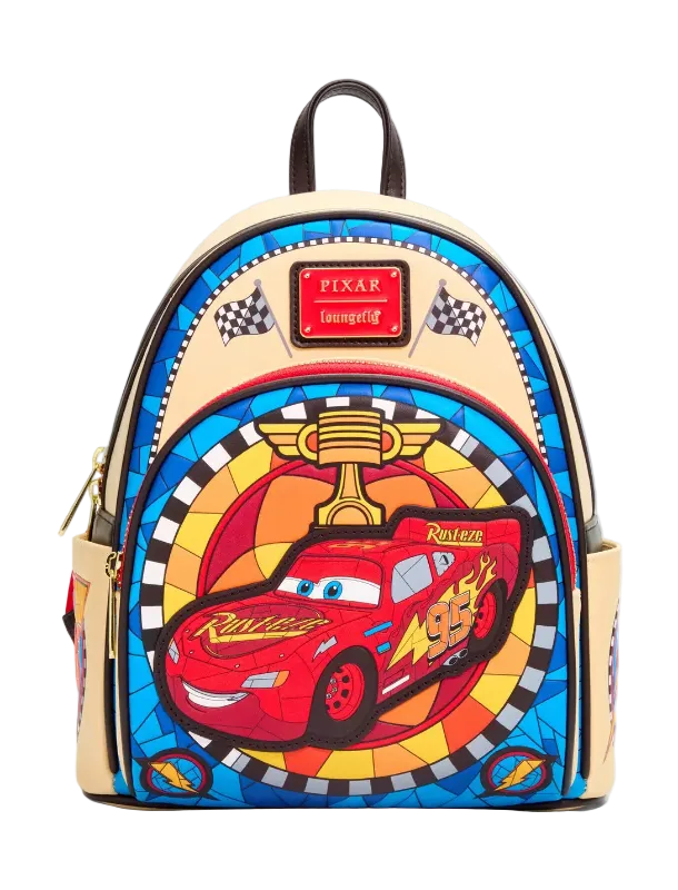 A Disney Pixar Lightning McQueen themed backpack featuring a colorful stained-glass style design with a red race car, trophy, and checkered flags on a light beige background.