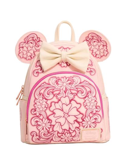 A pink mini backpack featuring embossed floral patterns, a large cream bow on top, and mouse-ear cutouts on the sides, shown against a plain white background.