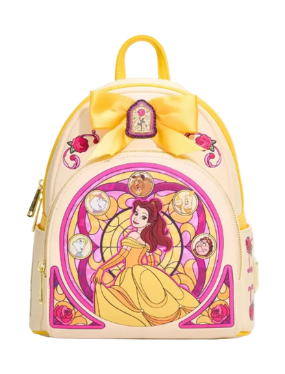 A Disney Beauty and the Beast themed mini backpack in a pale cream color with a large yellow bow on top, featuring a stained-glass style illustration of Belle centered on the front.