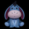 Blue donkey figurine with a bow on a white background