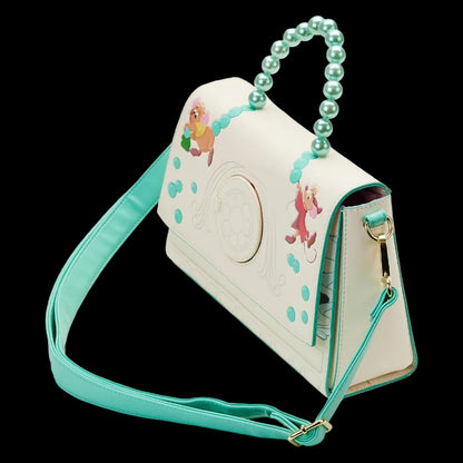 Children's handbag with mermaid design and turquoise strap on a white background