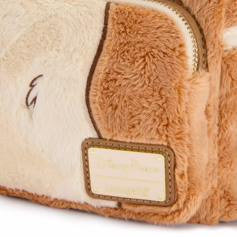 Close-up of a plush Disney Parks Loungies bag with fluffy cream and tan sections, a gold zipper, and a tan leather patch reading Disney Parks Loungies.