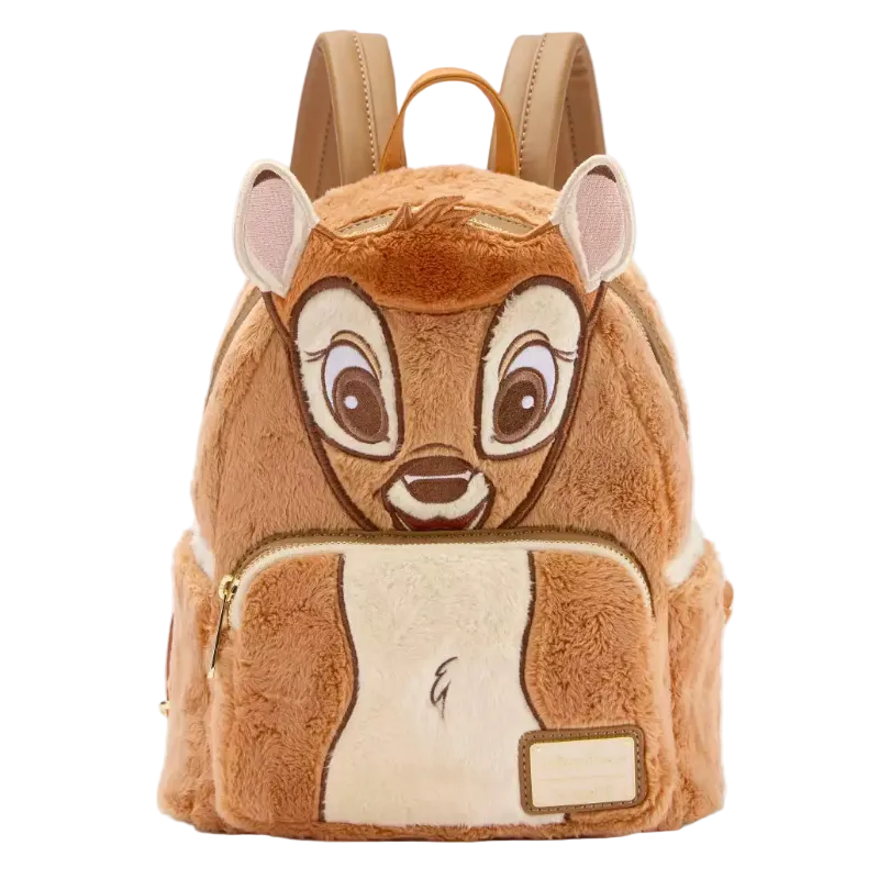 A plush character backpack designed to look like a brown animal face, featuring large embroidered eyes, pink inner ears, a cream-colored belly patch, and tan shoulder straps, shown on a plain white background.