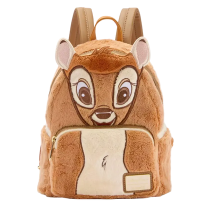 A plush character backpack designed to look like a brown animal face, featuring large embroidered eyes, pink inner ears, a cream-colored belly patch, and tan shoulder straps, shown on a plain white background.