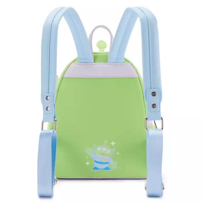 Green backpack with blue straps featuring a cartoon character on a white background