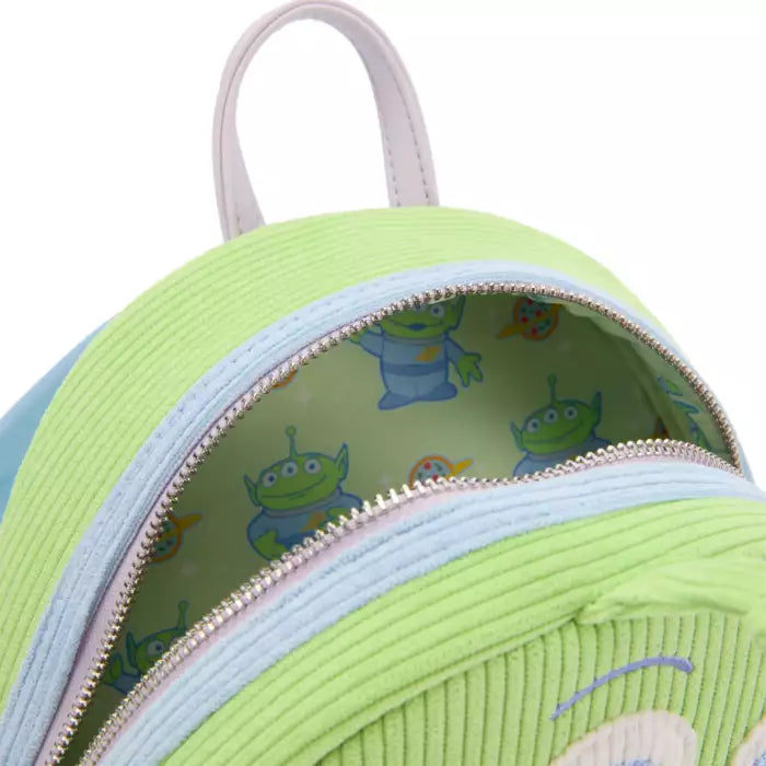 Green children's backpack with cartoon character design on a white background