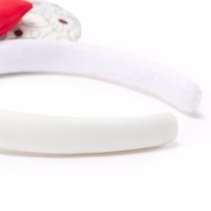 A white foam headband shown on a clean white background, with a small decorative red and white embellishment partially visible at the top left.