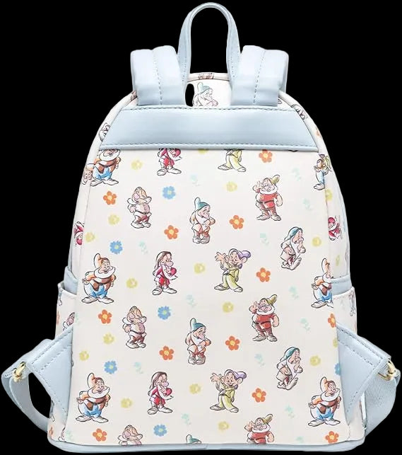 A small backpack featuring an all-over print of Disney's Snow White dwarfs and colorful flowers on an off-white background, with light blue trim, straps, and side pockets.