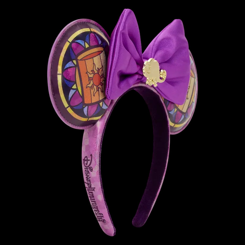 Purple mouse ears with a bow and decorative design on a white background