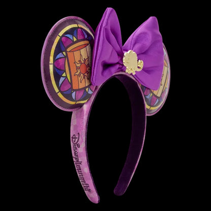 Purple mouse ears with a bow and decorative design on a white background