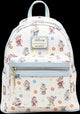 A Disney Loungefly mini backpack featuring an all-over print of Snow White's dwarves on a cream background with light blue trim and a silver-tone zipper.