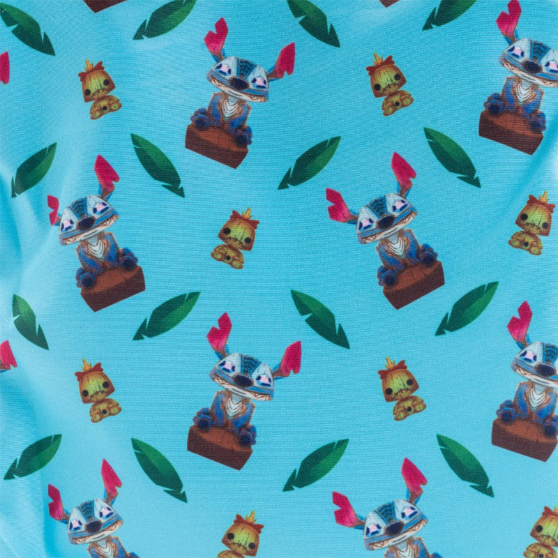 A close-up of a light blue fabric with a repeating pattern of Stitch wearing a cowboy hat, small yellow creatures, and green leaves.