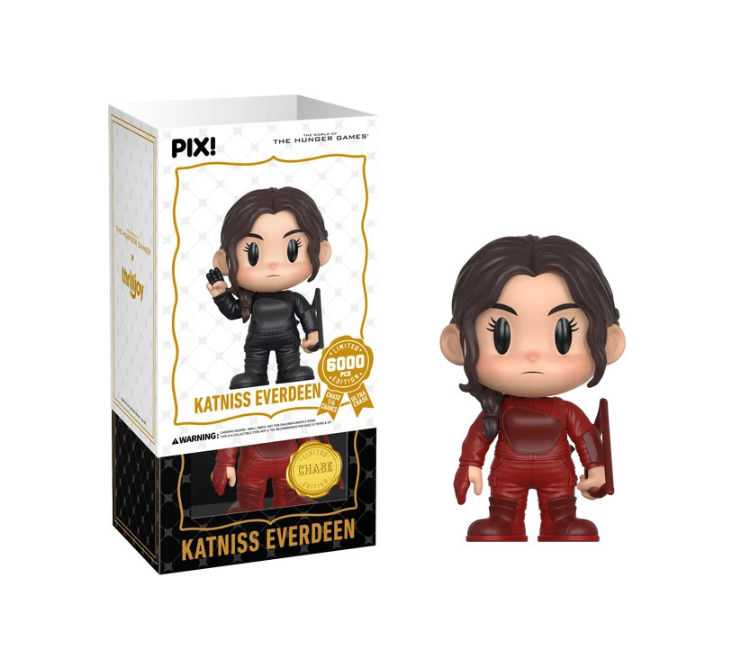 PIX! Katniss Everdeen chase figure in a red suit with a side braid and a red bow, beside her box with the white outer sleeve partly on.