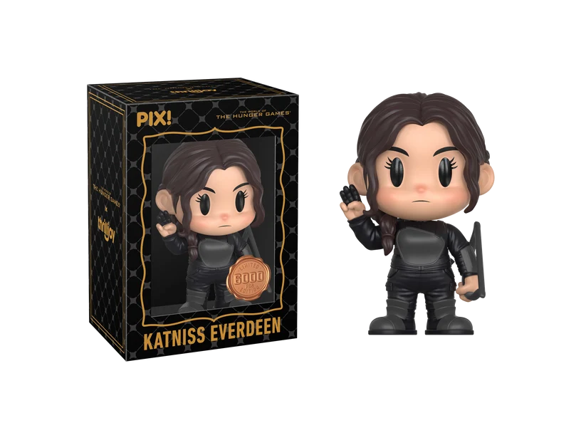 PIX! Katniss Everdeen vinyl figure in a black suit with a side braid, one hand raised and a bow at her side, next to her black window box.