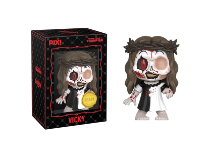 PIX! Vicky chase figure with a crown of thorns and disfigured face, standing next to her black window box labeled VICKY.