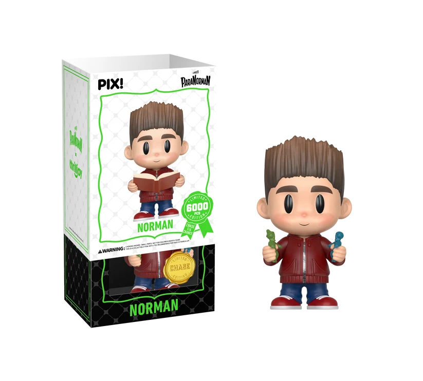 PIX! Norman chase figure holding a small green figurine and a small blue figurine, shown beside its box with the white outer sleeve partly lifted.