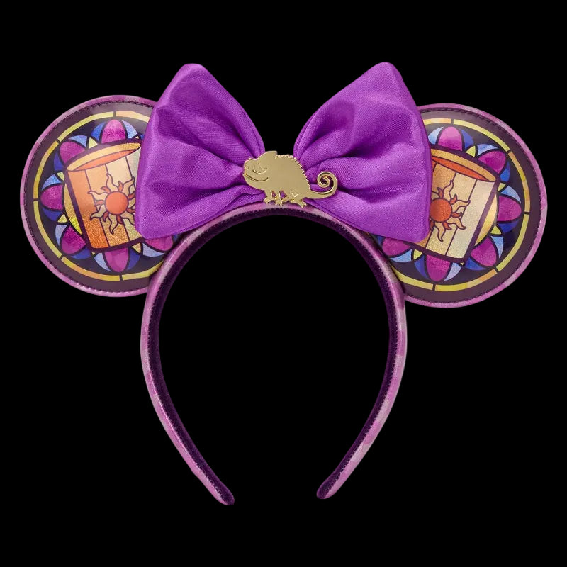 Purple mouse ears with a bow and chameleon design on a white background