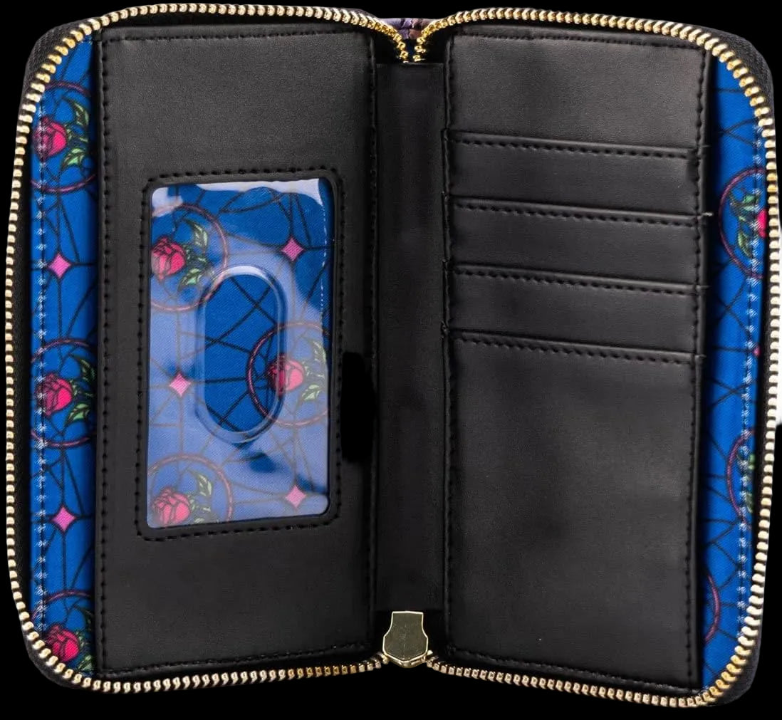 An open zip-around wallet or passport cover with a black interior, gold zipper trim, and a blue patterned exterior featuring pink floral motifs and circular line details.