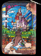 A zip-around wallet featuring a colorful stained-glass style illustration of a fairytale castle, a woman and a man by a fountain, sheep, and a bridge, shown on a plain white background.