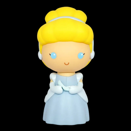 Toy figure of a character with blonde hair and blue eyes, wearing a light blue dress on a white background.