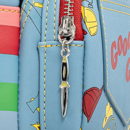 Colorful bag with a knife-shaped keychain attached to a zipper