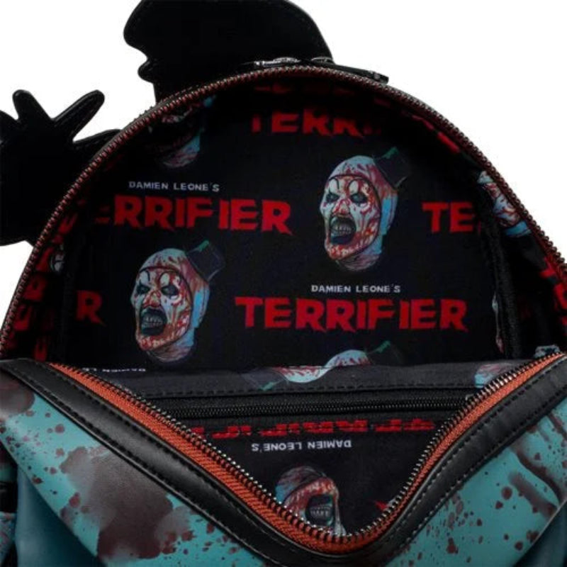 Backpack with 'Terrifier' design featuring a zombie face and blood splatter on a white background.