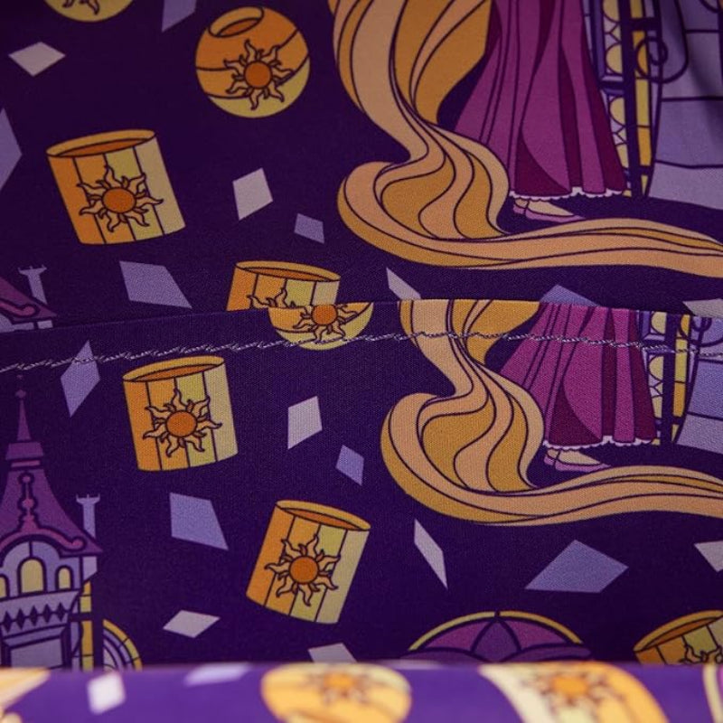 Fabric with Rapunzel design featuring long blonde hair and purple dress on a purple background.