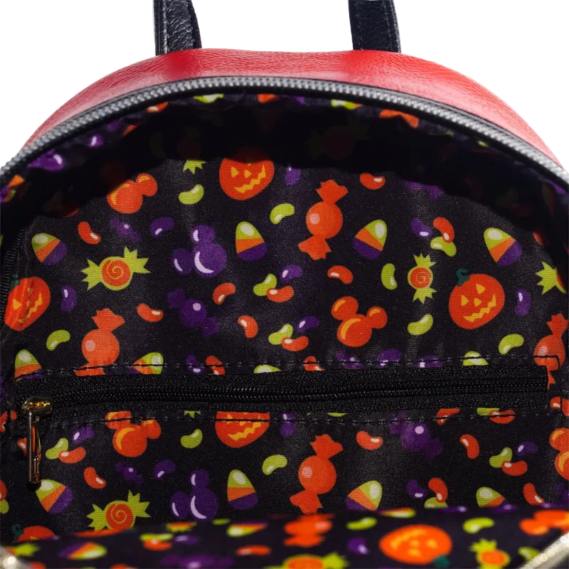 Backpack with Halloween-themed interior lining featuring pumpkins, ghosts, and candy corn.
