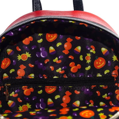 Backpack with Halloween-themed interior lining featuring pumpkins, ghosts, and candy corn.