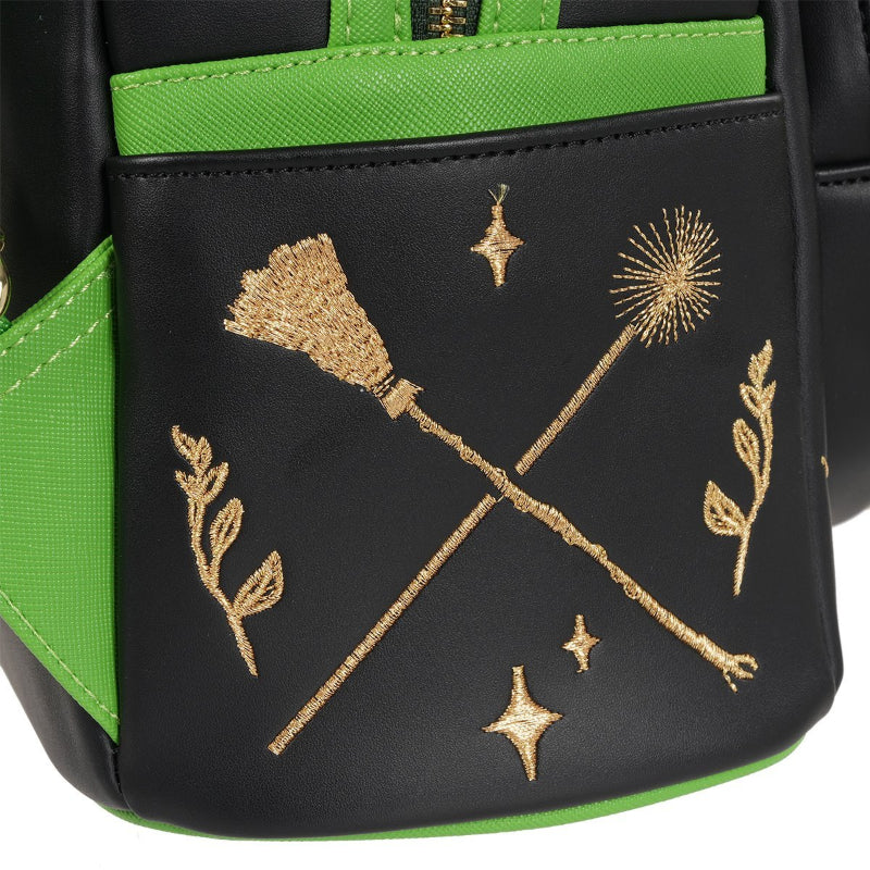 Black bag with gold embroidery of broomsticks and stars on a green background