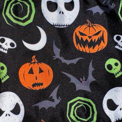 Halloween-themed fabric with pumpkins, skulls, and bats on a black background