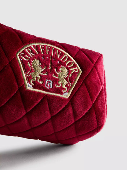 A Harry Potter™ makeup bag with a Gryffindor house emblem design