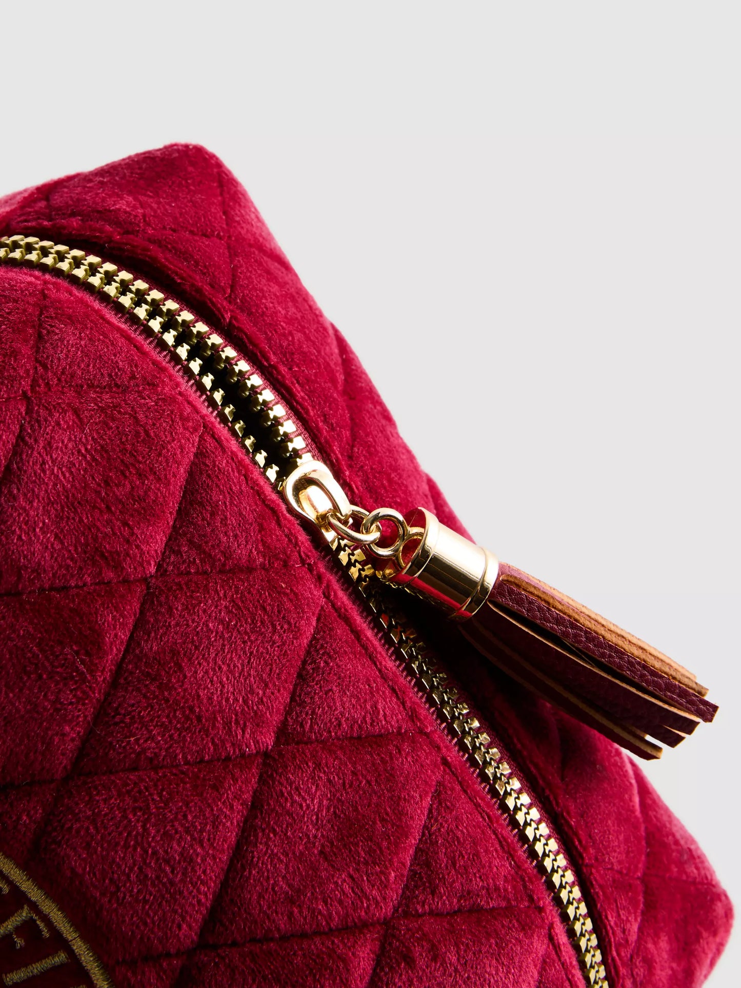 A Harry Potter™ makeup bag with a Gryffindor house emblem design