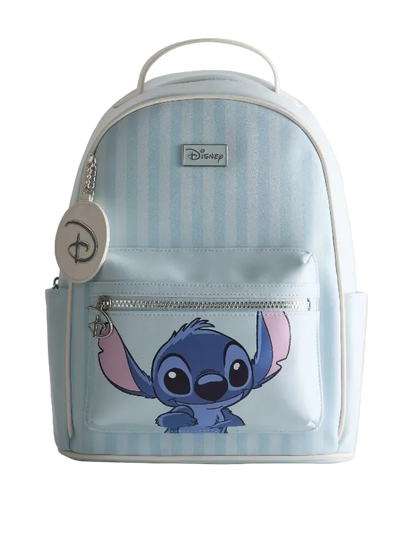 A Disney backpack featuring a light blue and white vertical stripe pattern, with a large graphic of Stitch on the front pocket. The backpack has a top handle, a front zippered pocket, a silver zipper, and a round Disney keychain charm hanging from the left side.